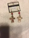 Burnished metal 'Faith' cross dangling earring. Color copper/red